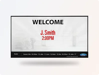 A digital Welcome Board in a car dealership lobby, greeting a scheduled sales or service customer by name.
