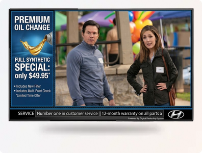 A simple Basic Lounge TV in a car dealership waiting room, showing branded content and a service status ticker.