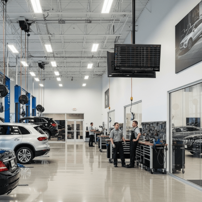 Dealership service drive display showing live repair status, appointment queue, and technician updates.